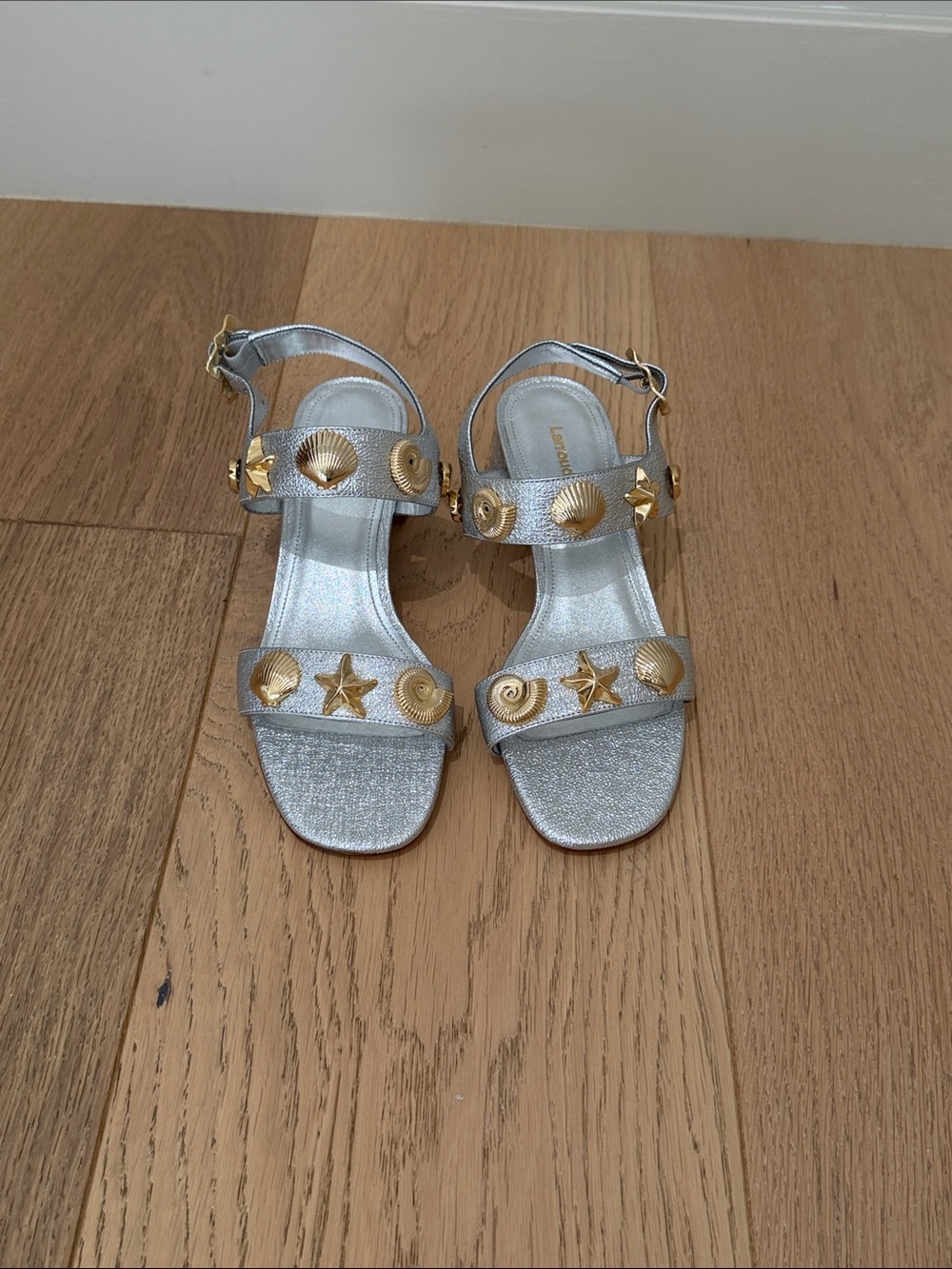 Larroudé Silver Block Heeled Sandals with Gold Shell Accents